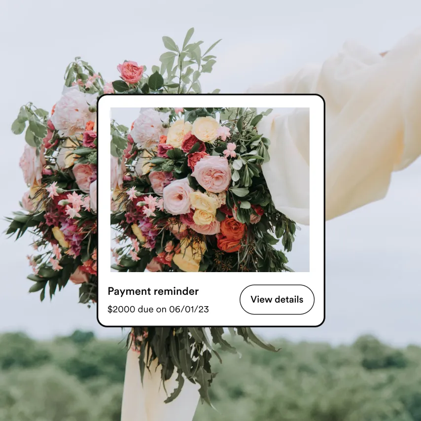 Close-up of elegant white wedding bouquet with roses and greenery