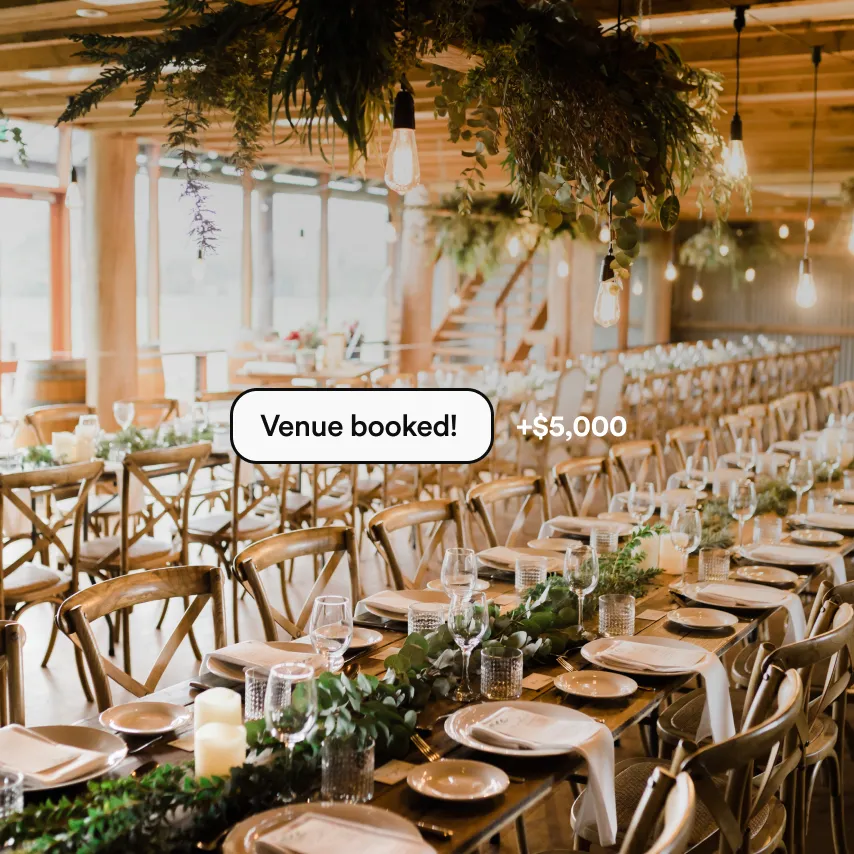 Outdoor wedding ceremony venue with floral arch and seating