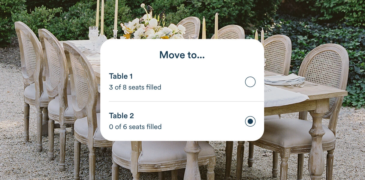 Zola seating chart tool showing a guest being moved to a new table