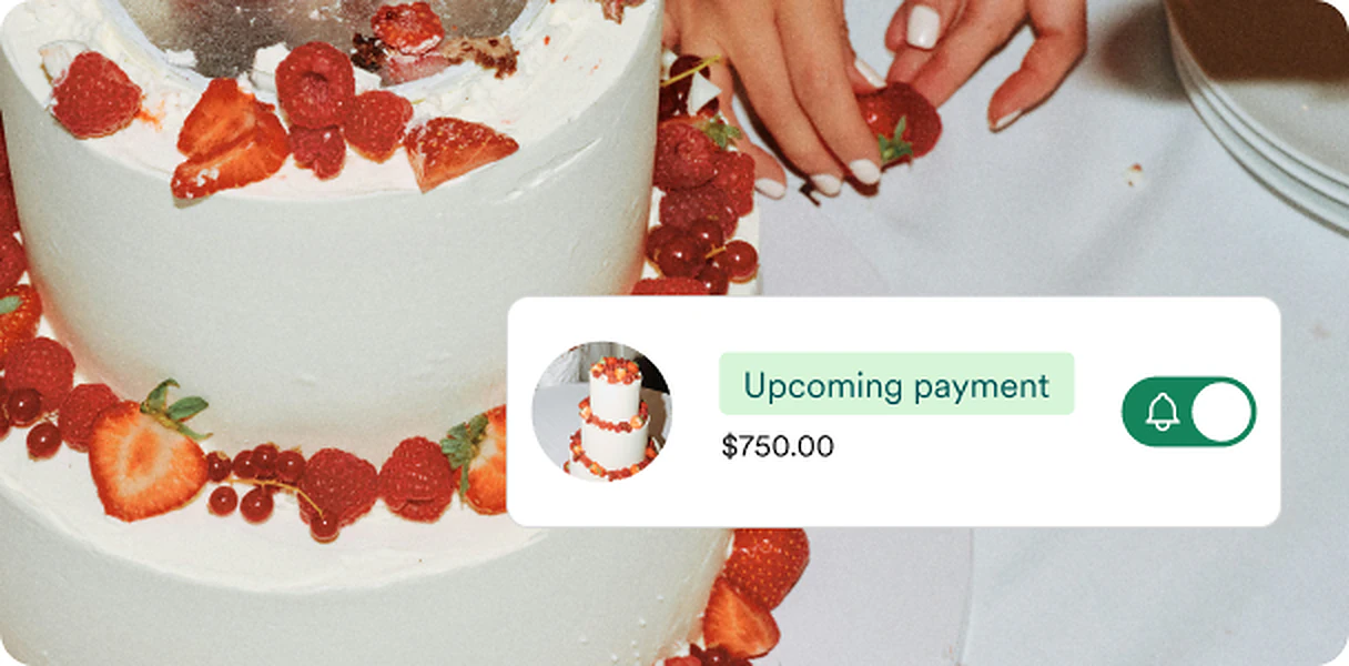 Wedding cake with upcoming vendor payment notification on Zola